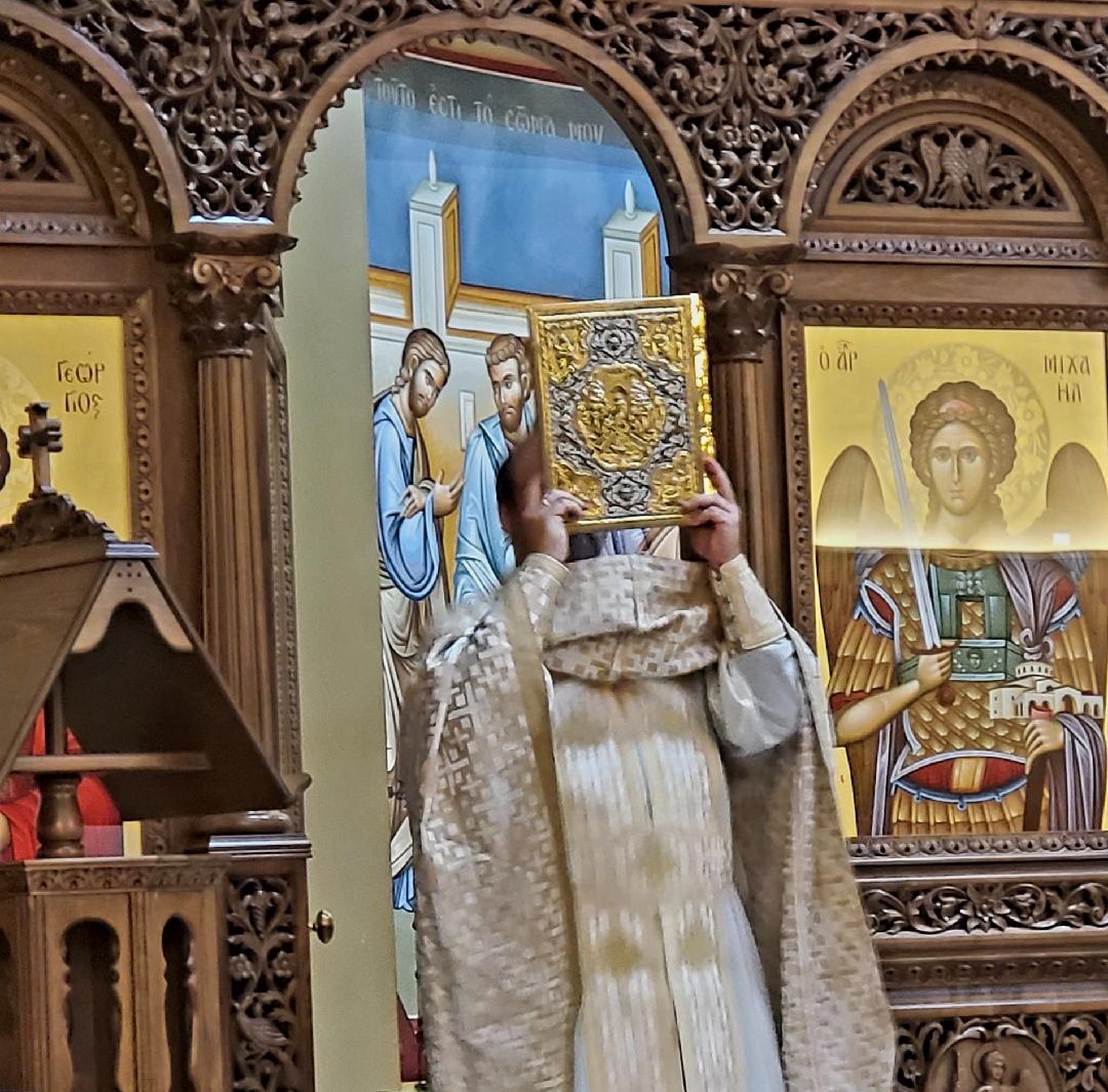 Priest reading the gospel